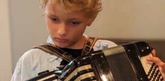 Boy must grow into this accordion