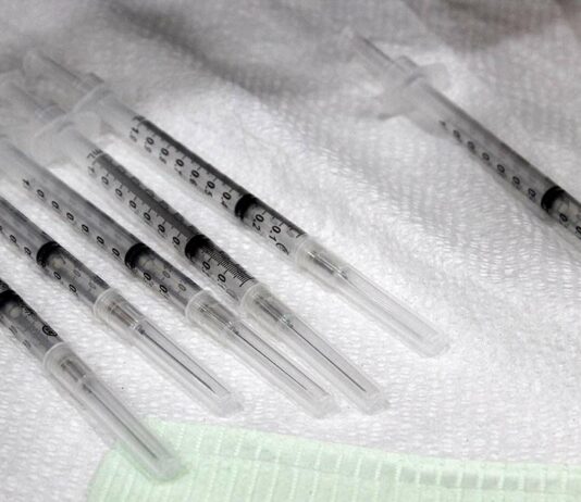 covid-19 vaccine syringe