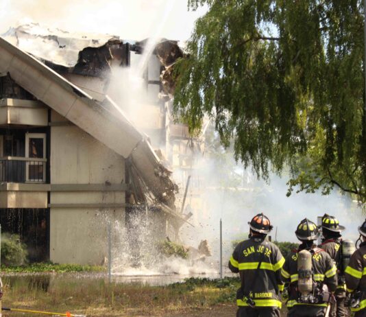 Fire continues to burn at 50,000-sq-ft office building deemed a “total loss” building collapse due to fire