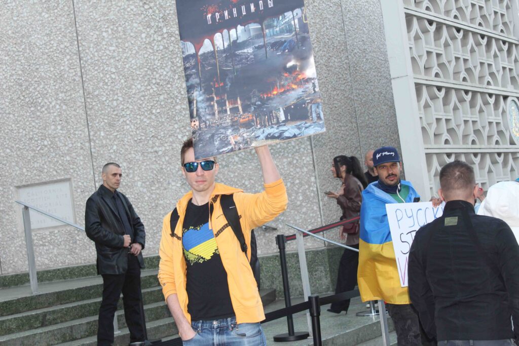 sunglasses guy with sign