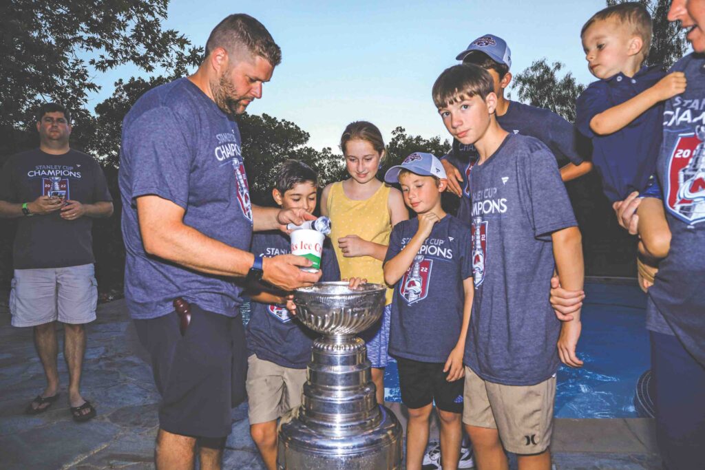 scooping ice cream into Stanley Cup