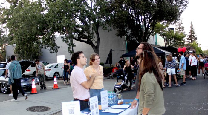 Kylie Clark booths with Rob Moore at Los Gatos Promenade event