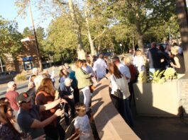 community members admire wall