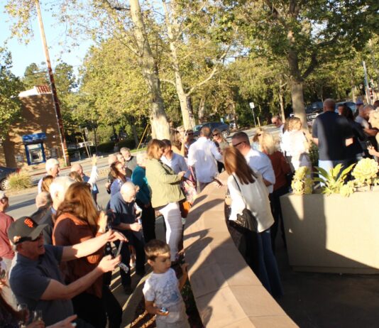 community members admire wall