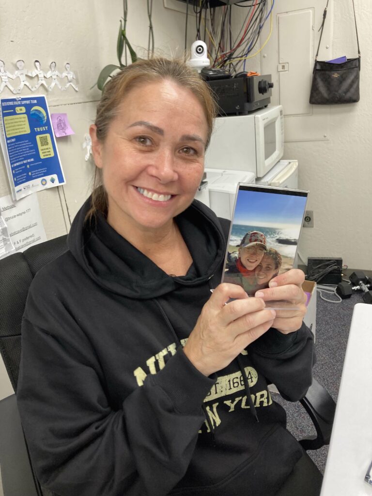 mom holds photo of son up