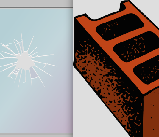cinder block and broken window