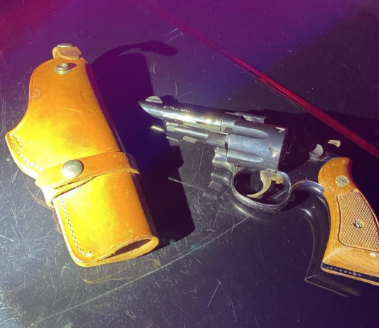 Police confiscate revolver after arresting man revolver and holster