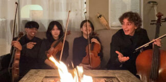 student musicians by the fire