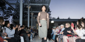 models walks on the runway in a cargo skirt and quilted top