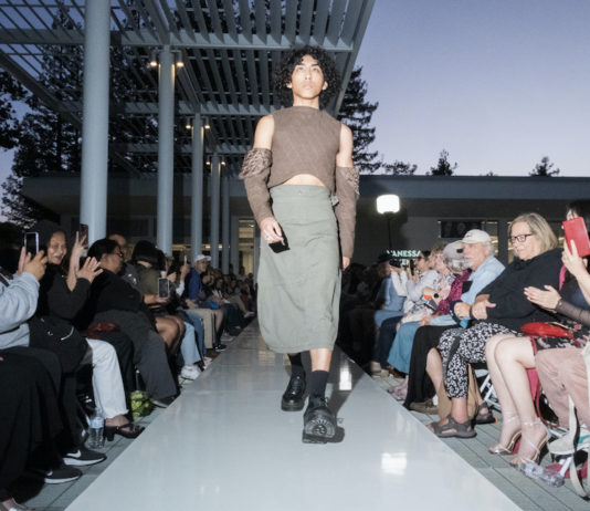 models walks on the runway in a cargo skirt and quilted top