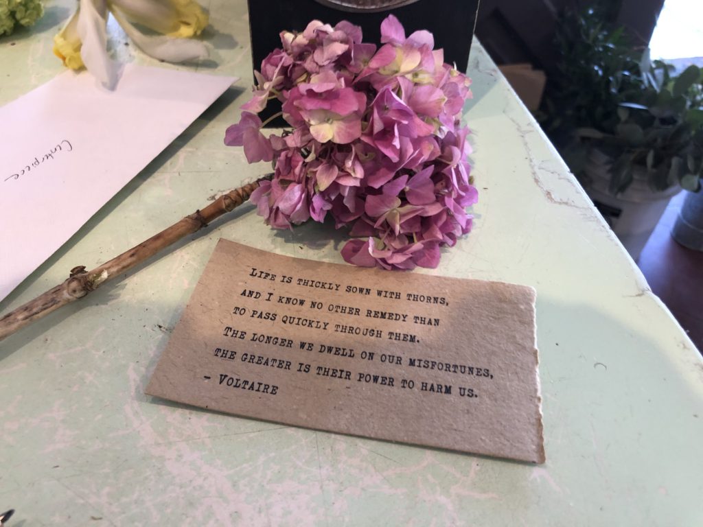 quote on a card with flowers