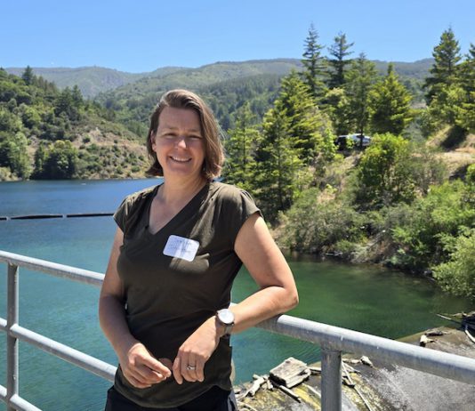 leaning on a railing in the outdoors