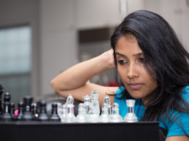 woman playing a chess game