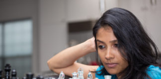 woman playing a chess game