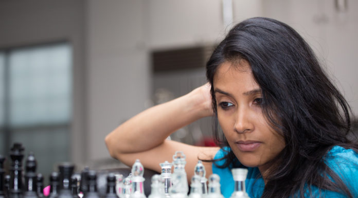 woman playing a chess game