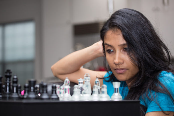 woman playing a chess game