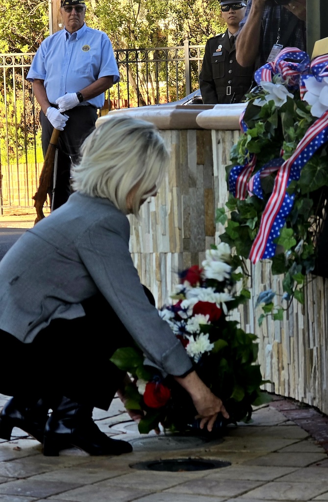 Mary Badame lays wreath