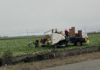 farmworkers with truck in the field