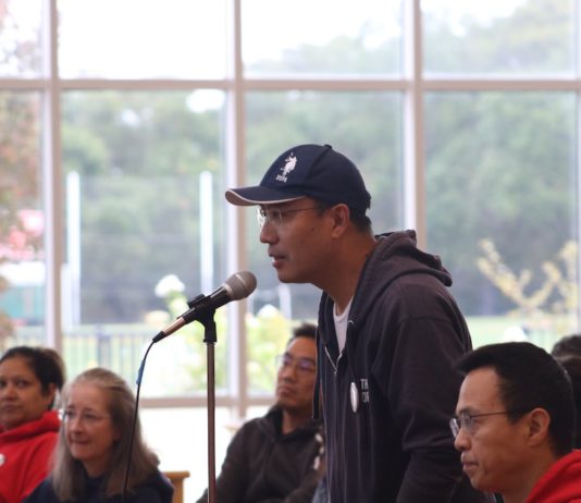 parent at the town hall mic