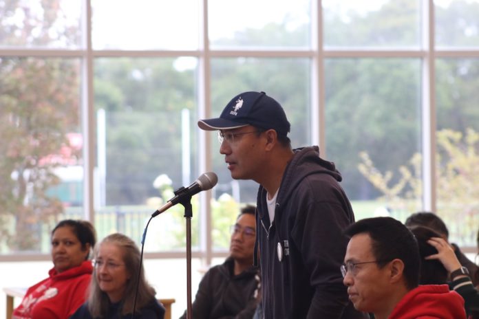 parent at the town hall mic