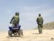 US Customs and Border Patrol agents on sand