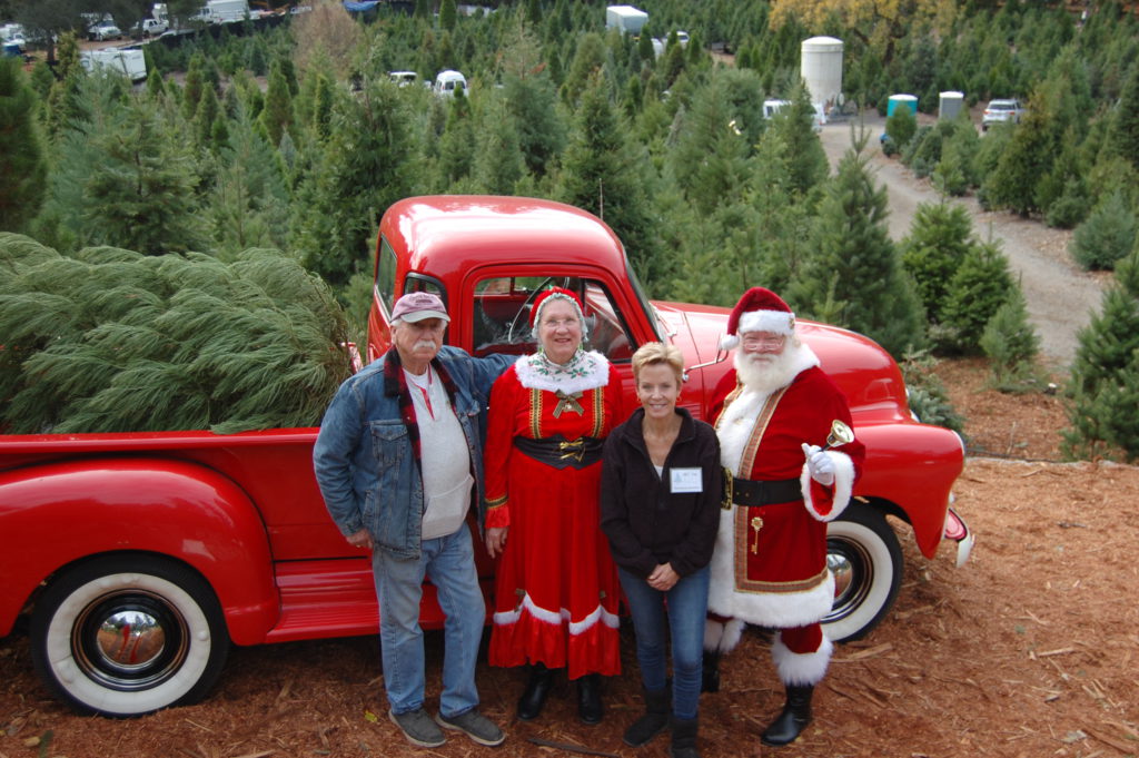 posing with Santa and Mrs. Claus