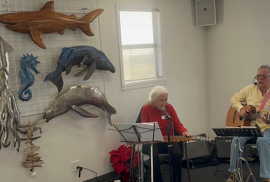 Robert seals and woman play music