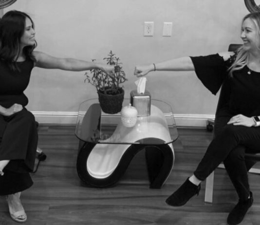 Main St Annex Hair Salon celebrating 5 years in business fist bump