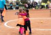 girls, softball players, hug