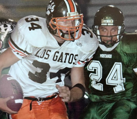 football player runs the ball