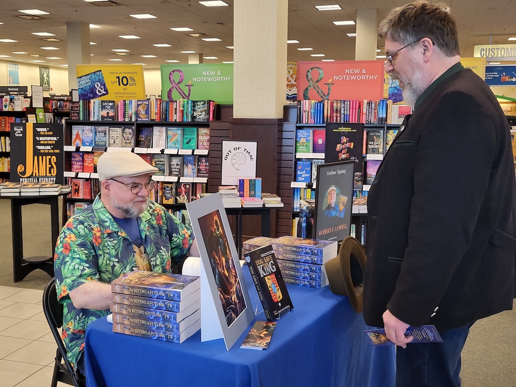 author signs book
