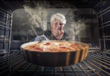 woman pulls baking from item