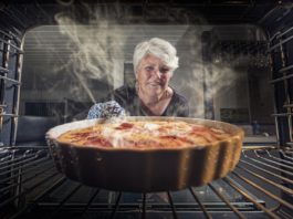 woman pulls baking from item