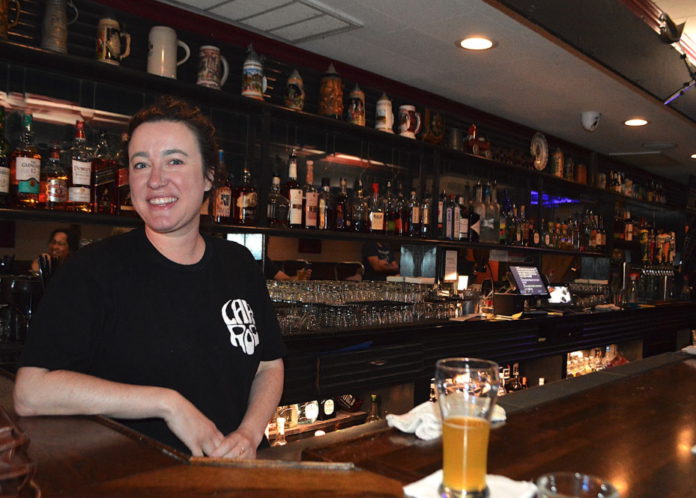 Jennifer behind the bar