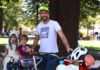 cyclist father with kids