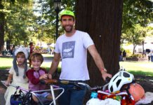 cyclist father with kids