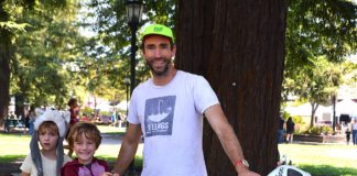cyclist father with kids