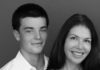Young man and woman pose for photo