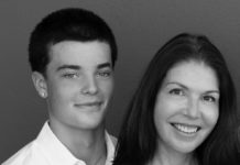 Young man and woman pose for photo