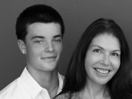 Young man and woman pose for photo