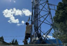 Daniel Roberts climbs a radio tower