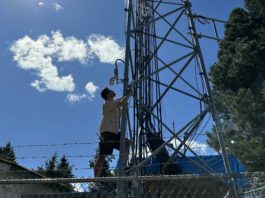 Daniel Roberts climbs a radio tower