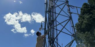 Daniel Roberts climbs a radio tower