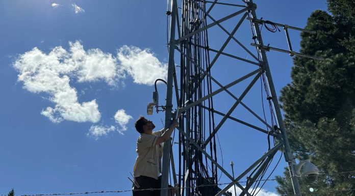 Daniel Roberts climbs a radio tower