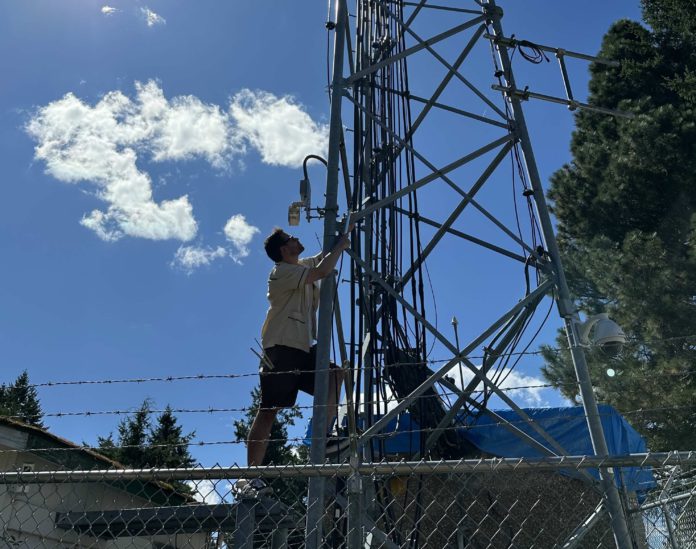 Daniel Roberts climbs a radio tower