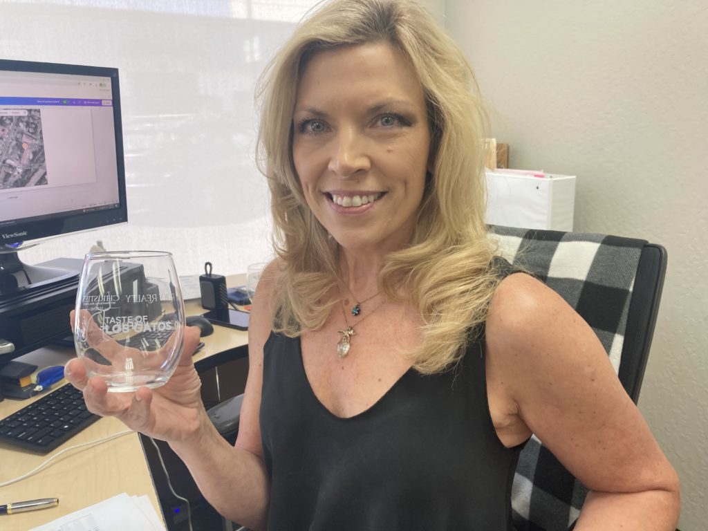 Rita Kelly holds glass