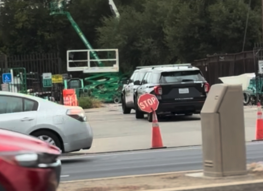 police cars and scissor lift