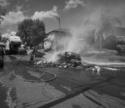 black and white photo of trash fire