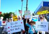 Protesters line both sides of Los Gatos Boulevard for “No Kings” rallies protesters