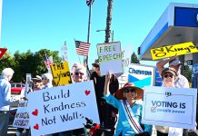 Protesters line both sides of Los Gatos Boulevard for “No Kings” rallies protesters
